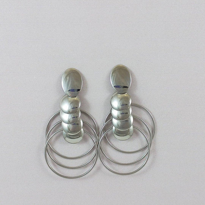 BRINCO DE ELOS EM ESPIRAIS - AÇO INOX - Donna Jóias Folheadas